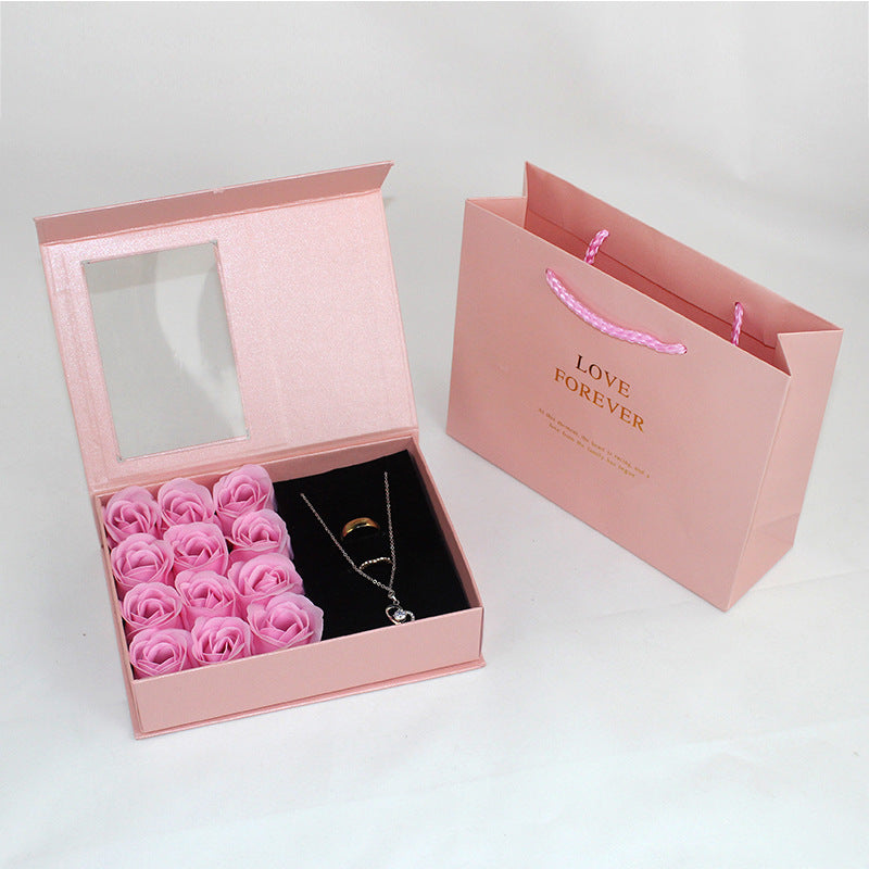 Gift box jewelry and lipstick with roses