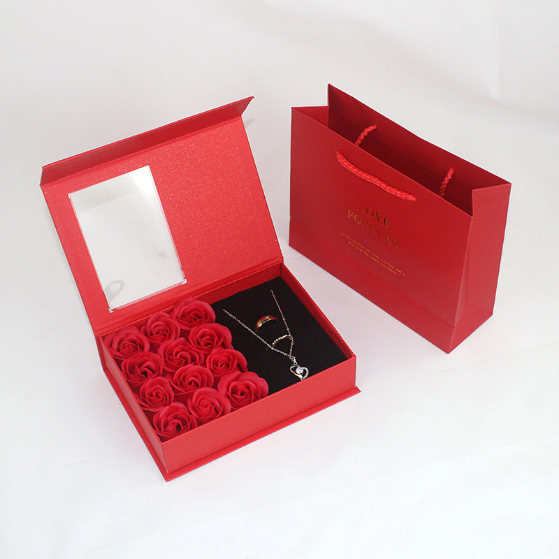 Gift box jewelry and lipstick with roses